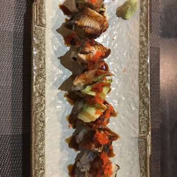 Kani House - Buford - Sea dragon roll. Soft shell crab, avocado, Masago topped with barbecue freshwater eel and sweet deal sauce. $14 - Japanese Near Me - Buford, Georgia