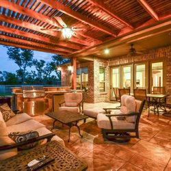 Lone Star Patio Builders | Custom Patio Covers & Pergolas - Hand-crafted Western Red Cedar pergola providing elegant partial shade for a backyard deck.
