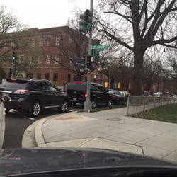 Photo of DC Vehicle Inspection Station - Washington, DC, DC, US. Looks like a line of parked cars waiting.  But the line is moving.