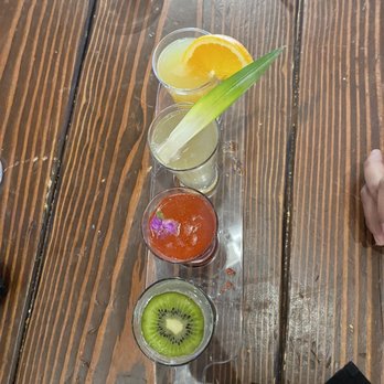 The Lola - Mimosa flight (orange, pineapple, pomegranate, kiwi) - Cocktail Bars Near Me - Glendale, Arizona The Lola - Mimosa flight (orange, pineapple, pomegranate, kiwi) - Cocktail Bars Near Me - Glendale, Arizona