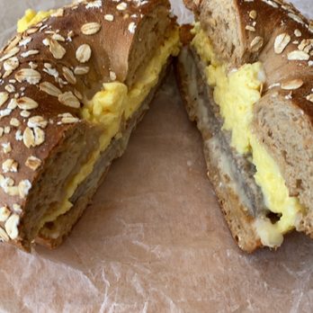 Muffin House Cafe - Sausage, egg, and American cheese on a honey wheat bagel - Coffee & Tea Near Me - Hopkinton, Massachusetts