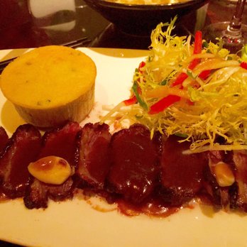 Buddakan - Chinese five-spice duck breast with scallion spoonbread. - Asian Fusion Near Me - Philadelphia, Pennsylvania