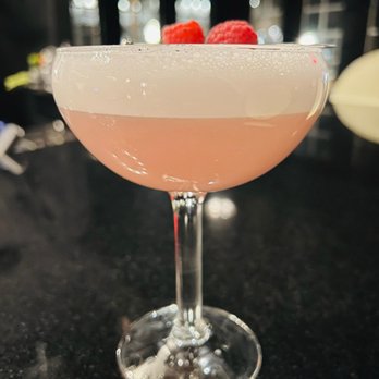 M Bevy - a pink cocktail with a raspberry garnish - Bars Near Me - Chagrin Falls, Ohio M Bevy - a pink cocktail with a raspberry garnish - Bars Near Me - Chagrin Falls, Ohio