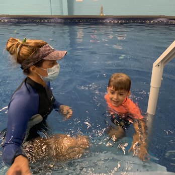 ISR - Oahu - Coach Audrey teaching my son water safety. She also takes precautions with COVID-19 by wearing a mask. - Swimming Lessons/Schools Near Me
