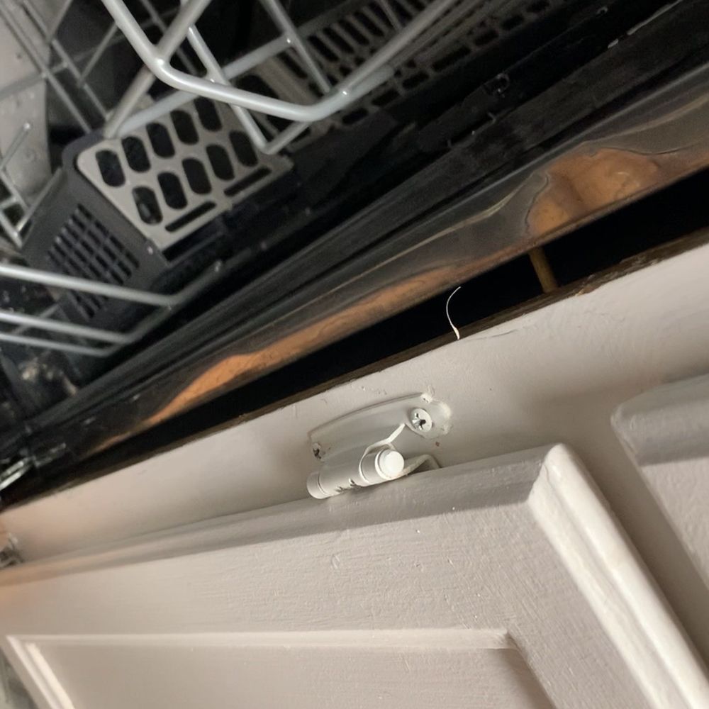 Nailed It - You can see the screw sticking out about 1 and 1/2 inches. If you gently press dishwasher, it moves. - Handyman Near Me