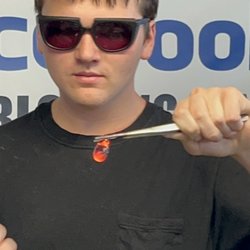 The Glass Blowing Center - My son finishing his pendant