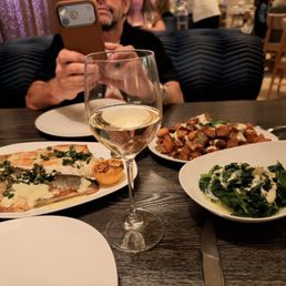 Branzino, crispy potatoes & lemon spinach