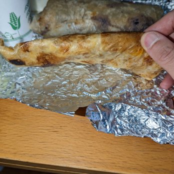 Tacombi - side view of the thinness of the 6 inch burrito and one tortilla "quesadilla". the food seen in this picture cost $38 pre-tip. - Tacos Near Me - Forest Hills, New York Tacombi - side view of the thinness of the 6 inch burrito and one tortilla "quesadilla". the food seen in this picture cost $38 pre-tip. - Tacos Near Me - Forest Hills, New York