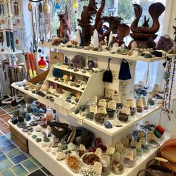 Makers Station Gallery - Pictured is a large variety of semi precious stones and crystals, hand carved Balinese wood carvings, Woodstock wind chimes and more...