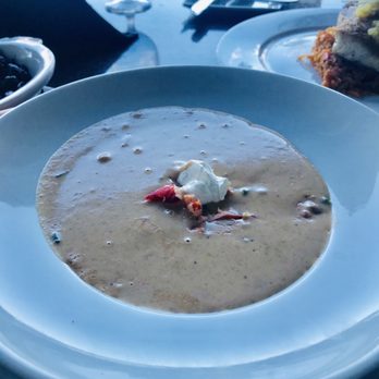 Azure Oceanfront Dining - Bowl of lobster bisque with chunks of lobster meat poured table side. - Seafood Near Me - Daytona Beach Shores, Florida