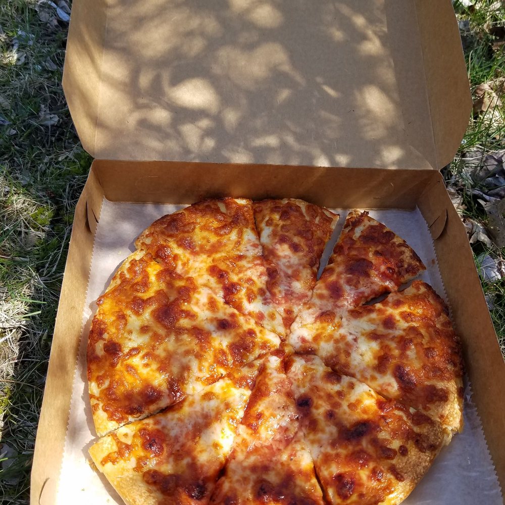 a pizza in a cardboard box a pizza in a cardboard box
