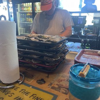 Dusty's Oyster Bar - One of the service shocking oysters. - Seafood Near Me - Panama City Beach, Florida Dusty's Oyster Bar - One of the service shocking oysters. - Seafood Near Me - Panama City Beach, Florida