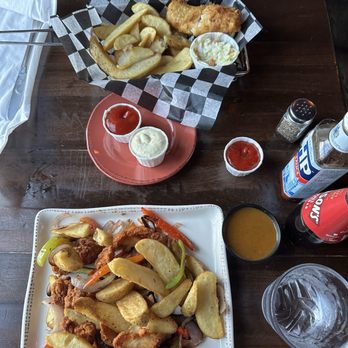 Sláinte Irish Pub and Restaurant - Fish and chips (top), Spice bag (bottom) - Pubs Near Me - Baltimore, Maryland Sláinte Irish Pub and Restaurant - Fish and chips (top), Spice bag (bottom) - Pubs Near Me - Baltimore, Maryland