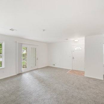 Eagle View Court 55+ Community - Open living space with carpeted floor and windows - Retirement Homes Near Me - Middle Island, New York Eagle View Court 55+ Community - Open living space with carpeted floor and windows - Retirement Homes Near Me - Middle Island, New York