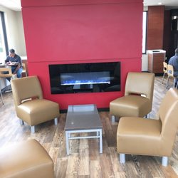 Wendy's - Indoor seating area with faux fireplace