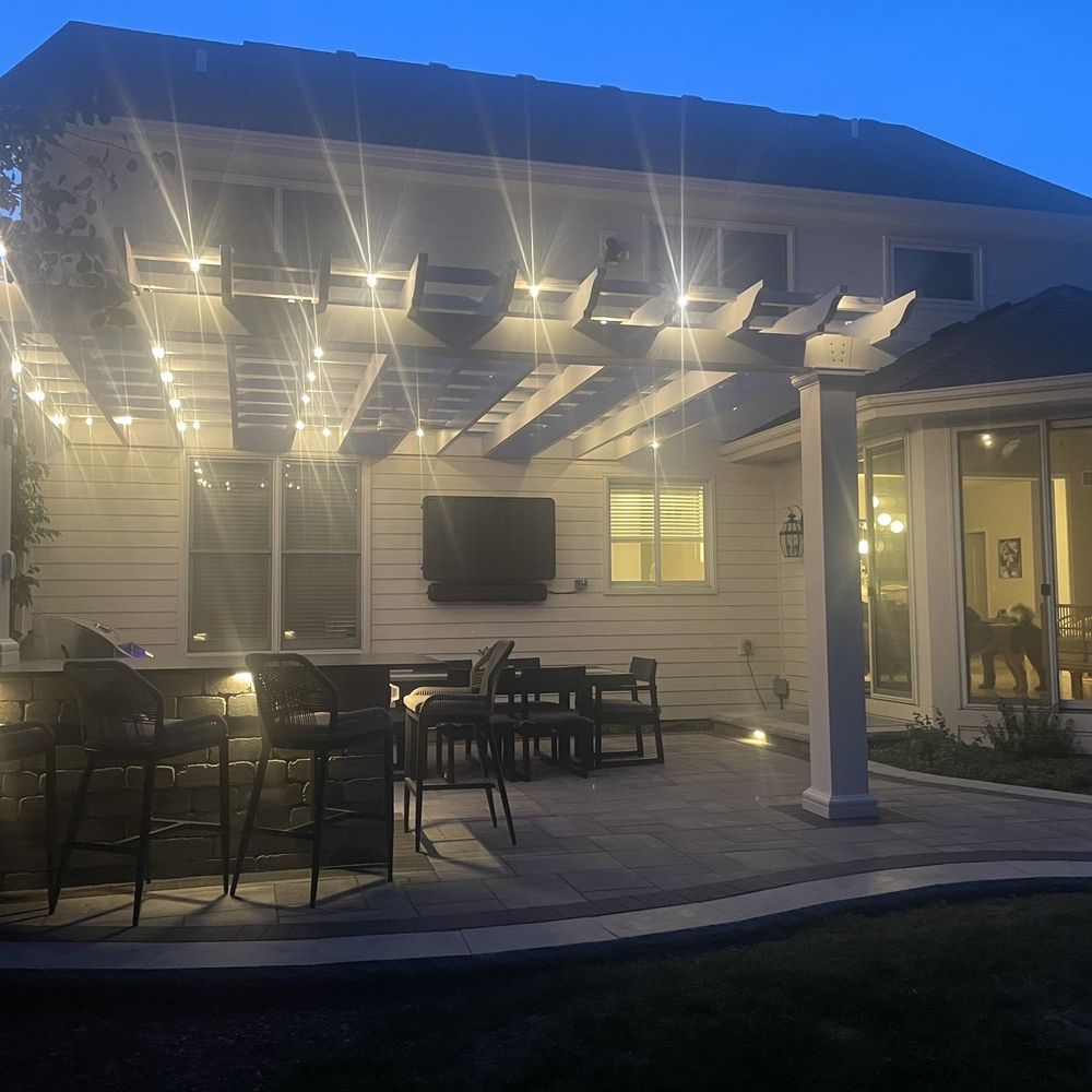 Brick Logik - a patio with a tv on the wall - General Contractors Near Me - Aurora, Illinois