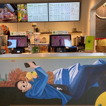 Real Fruit Bubble Tea - a mural of a man lying on the counter - Bubble Tea Near Me - Ottawa, Ontario Real Fruit Bubble Tea - a mural of a man lying on the counter - Bubble Tea Near Me - Ottawa, Ontario