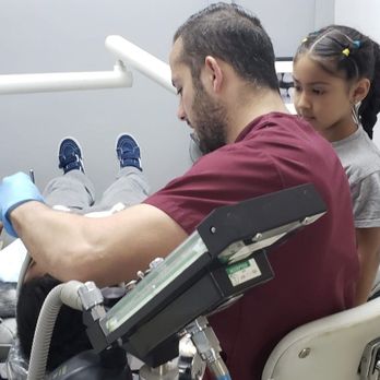 Omid Dental - Dr. Ardy explains the process to show the kids there's nothing to be afraid about. - Cosmetic Dentists Near Me - South Gate, California Omid Dental - Dr. Ardy explains the process to show the kids there's nothing to be afraid about. - Cosmetic Dentists Near Me - South Gate, California