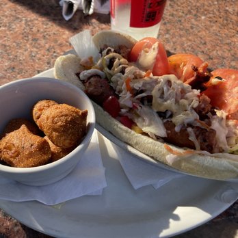 Railshake - Andouille sausage po' boy with hush puppies - Bars Near Me - Highland, Illinois