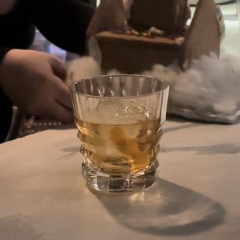 Midlina - Gingerbread old-fashioned served in a gingerbread house. - Speakeasies Near Me - Baltimore, Maryland