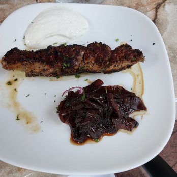 Meson Sabika - Pincho de Solomillo Grilled beef tenderloin skewer rolled in cracked black pepper, served with caramelized onions, horseradish sour cream - Tapas Bars Near Me - Naperville, Illinois Meson Sabika - Pincho de Solomillo Grilled beef tenderloin skewer rolled in cracked black pepper, served with caramelized onions, horseradish sour cream - Tapas Bars Near Me - Naperville, Illinois