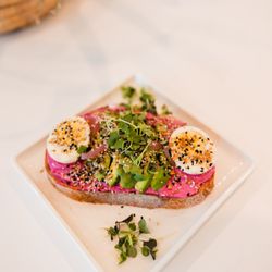 Real + Raw 30A Organic Eatery + Market - Avocado beet hummus toast with organic local egg