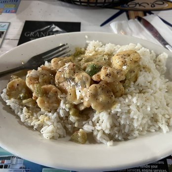 J Michael's - Shrimp and curry sauce over rice - Seafood Near Me - Panama City Beach, Florida