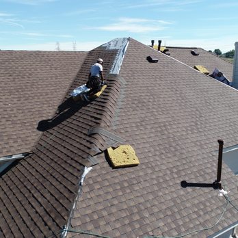 Qualitas Roofing and Construction - two men working on a roof - Roofing Near Me - Keller, Texas Qualitas Roofing and Construction - two men working on a roof - Roofing Near Me - Keller, Texas
