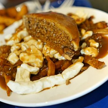 Fromagerie St-Albert - Tourtiere Poutine.  $10.99 plus tax.  Yes that is a Quebec meat pie on a poutine.   WTF???? - Cheese Shops Near Me - St-Albert, Ontario