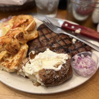 LongHorn Steakhouse - 12oz ribeye combo with grilled shrimp and so tender baked potato. - Steakhouses Near Me - Temecula, California