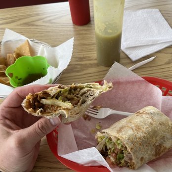 Fuego Taco - Pastor burrito, chips and salsa remnants - Mexican Near Me - Alsip, Illinois Fuego Taco - Pastor burrito, chips and salsa remnants - Mexican Near Me - Alsip, Illinois