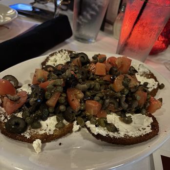 DiGiulio Brothers - First time having this. Will get again! Eggplant Cripers with goat cheese, Greek olives, tomatoes, and capers. Delicious! - Italian Near Me - Baton Rouge, Louisiana