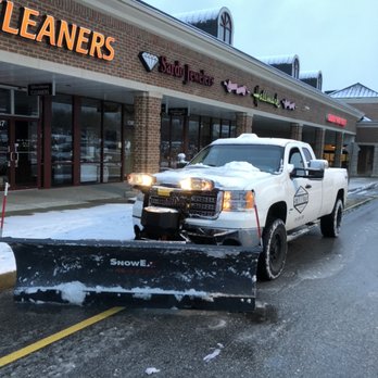 Stanaitis Landscaping and Construction - a snow plow in front of a store - Landscaping Near Me Stanaitis Landscaping and Construction - a snow plow in front of a store - Landscaping Near Me