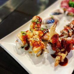 Mootone Fine Japanese Cuisine - Phoenix Maki - Spicy crabstick, torched salmon on top, with tobiko, eel sauce, scallions.
