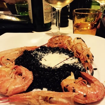 La locanda delle Due Suocere - Black rice with prawns and Gorgonzola sauce. Both the Gorgonzola and rice are being produced/cultivated locally in Novara - Italian Near Me - Novara, NO