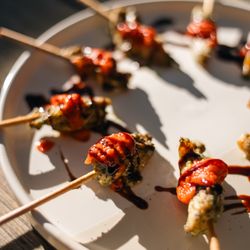 Society Cuisine - Pesto Chicken Skewers: Oven-dried tomato coulis & balsamic glaze