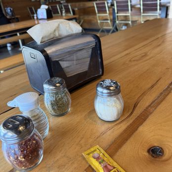 Lazy Moon Pizza - Table, waiting for food, free condiments to add - Pizza Near Me - Orlando, Florida Lazy Moon Pizza - Table, waiting for food, free condiments to add - Pizza Near Me - Orlando, Florida