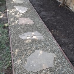 Izote landscaping - Stepping stone with. White gravel