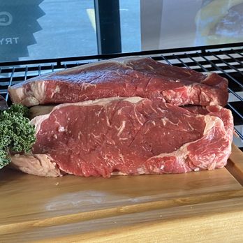 Ribeye Butcher Shop - steaks and broccoli on a cutting board - Butcher Near Me - Edmonton, Alberta Ribeye Butcher Shop - steaks and broccoli on a cutting board - Butcher Near Me - Edmonton, Alberta