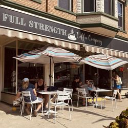 Full Strength Coffee - Full Strength entrance and outdoor tables.