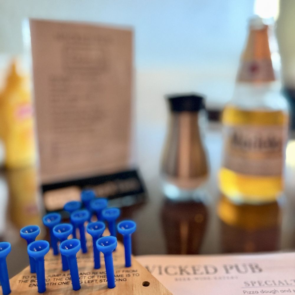 Wicked Pub - Peg game on the table - Pizza Near Me - Fort Myers, Florida Wicked Pub - Peg game on the table - Pizza Near Me - Fort Myers, Florida