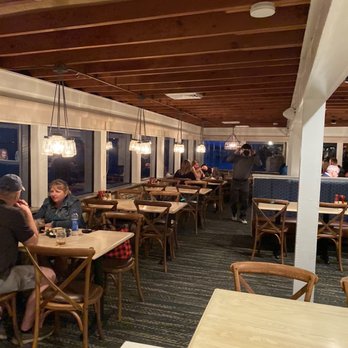Aunt Catfish's - Inside at night, the docks are through those windows - Southern Near Me - Port Orange, Florida