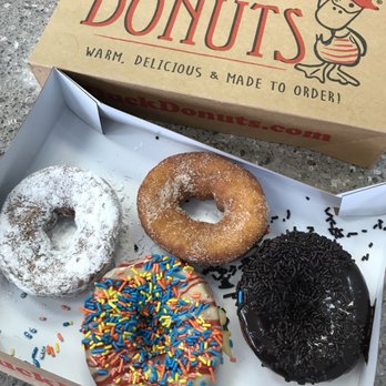 Duck Donuts - Powdered sugar, cinnamon sugar, chocolate glazed with chocolate sprinkles, sunrise? Lemon glaze with blueberry - Donuts Near Me - Herndon, Virginia Duck Donuts - Powdered sugar, cinnamon sugar, chocolate glazed with chocolate sprinkles, sunrise? Lemon glaze with blueberry - Donuts Near Me - Herndon, Virginia