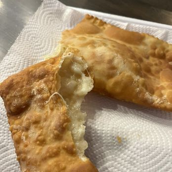 Pão Brasil Bakery - a half eaten pastry on a napkin - Bakeries Near Me - Framingham, Massachusetts