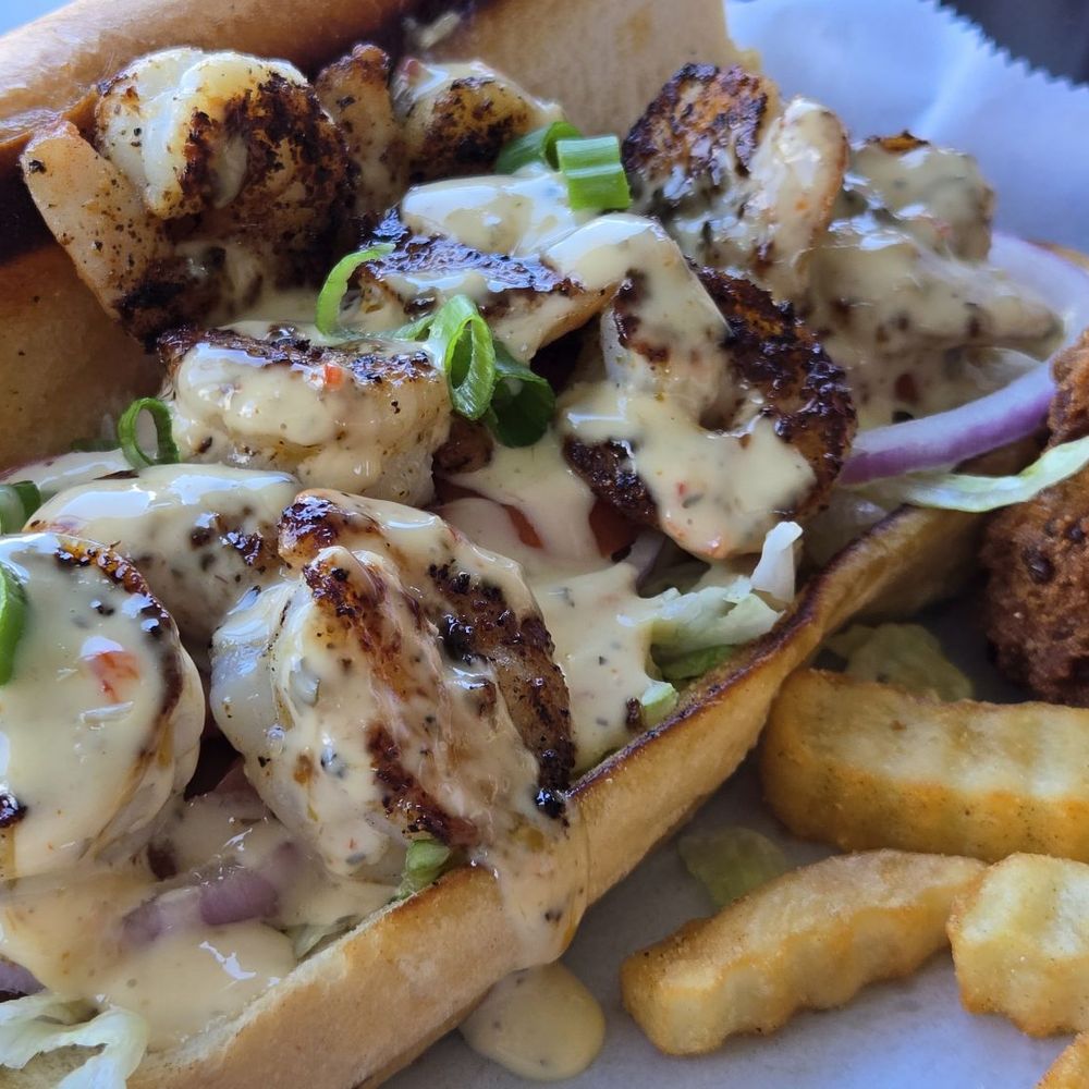 Safe Harbor Seafood - Shrimp Po Boy with complimentary conch fritters and crinkle fries - Seafood Near Me - Jacksonville, Florida Safe Harbor Seafood - Shrimp Po Boy with complimentary conch fritters and crinkle fries - Seafood Near Me - Jacksonville, Florida