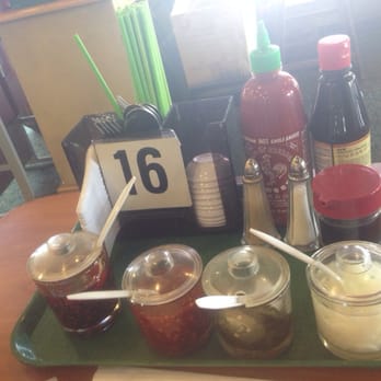 New Saigon - On every table jalapenos, onions, and 3 types of chilies. Oil, paste and sriracha - Vietnamese Near Me - Bakersfield, California