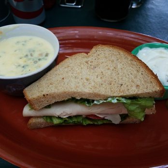 Molly's Souper - Half sandwich with soup (chicken and wild rice) with a small side of Apple crisp. - Breakfast & Brunch Near Me - Upland, California