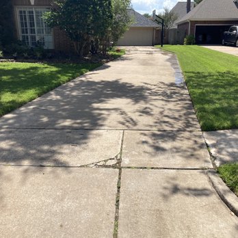 Austin's Outdoor Services - a sidewalk with a crack in it - Pressure Washers Near Me Austin's Outdoor Services - a sidewalk with a crack in it - Pressure Washers Near Me