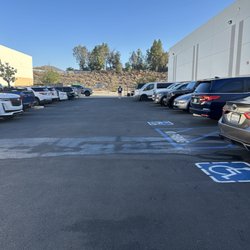 Get It Done Sports Arena - Parking lot. Some Spaces in the back if they allow the use.