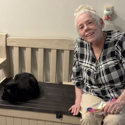 You can see her sitting right next to my sister who adopted her